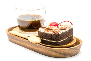 Chocolate cake and a cup of coffee in a wooden tray