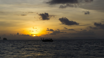 Naklejka na ściany i meble Boats on the sea sunset