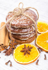 Gingerbread cookies, cinnamon and orange slices. Christmas decoration.