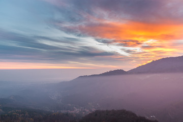 View towards the Sacro Monte (also called Santa Maria del Monte), Varese and the Po Valley at sunset, Italy. In 2003 entered from UNESCO in list of World Heritage 