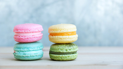 colorful cake macaron or macaroon on wooden background.