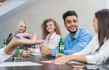 Fototapeta na wymiar Business People Group Sit At Office Desk Meeting, Young Smiling Businesspeople Team Conference Discussion Project Mix Race People Cooperation