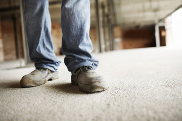 Closeup lowsection of a male construction worker at building site