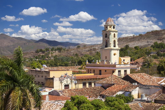 View over pantiled rooftops of the town towards the belltower of The Convento de San Francisco de Asis, Trinidad, Cuba 