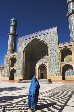 Lady wearing a blue burqua outside the Friday Mosque (Masjet-e Jam), Herat, Afghanistan