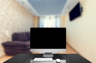 computer on a table in an office