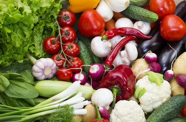 Background of fresh vegetables and greens closeup