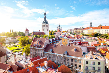 Cityscape aerial view on the old town with saint Nicholas church tower and Toompea hill in Tallin, Estonia - obrazy, fototapety, plakaty