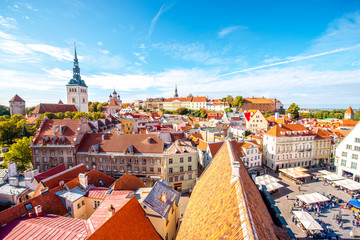 Cityscape aerial view on the old town with saint Nicholas church tower and Toompea hill in Tallin, Estonia - obrazy, fototapety, plakaty