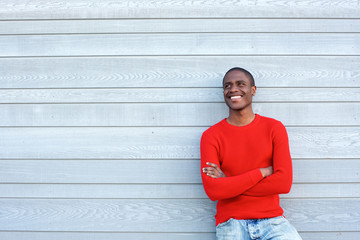 cool young black guy smiling with red sweater