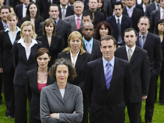 Portrait of a confident businessman with multiethnic team