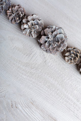 Christmas background with xmas tree and sparkle bokeh lights on wooden canvas background. Merry christmas card. Winter holiday theme. Happy New Year. Space for text. Happy Holidays