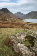Beautiful sunset landscape image of Wast Water and mountains in