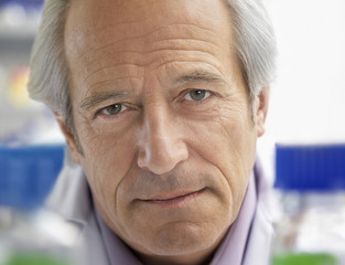Extreme closeup of a confident mature male scientist
