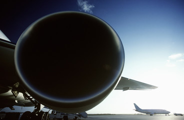 Fototapeta na wymiar Boeing 767 jet aircrat engine foreground Boeing 737 in background.