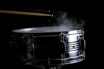 Drum sticks hit on the snare drum