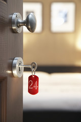 Key in hotel room's door - obrazy, fototapety, plakaty