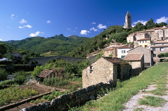 View to village on hillside above the Jaur river, Olargues, Herault, Languedoc-Roussillon, France