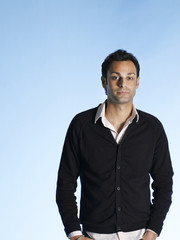 Fototapeta premium Portrait of handsome young man isolated on blue background