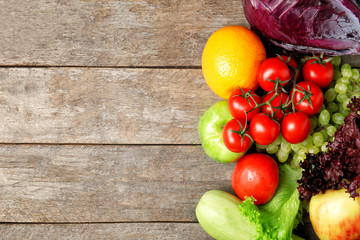 Fruits and vegetables on wooden background