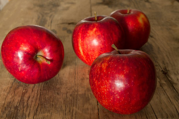 red apples on a wooden background