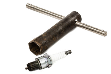 Fototapeta premium Old wrench key and spark plug, isolated on white, with clipping
