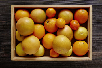 box filled with variety of citrus fruits