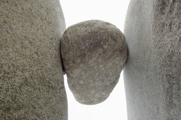 Rock wedged between two boulders