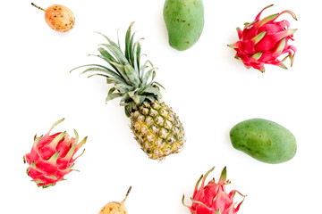 Exotic fruits: mango, pineapple, passion fruit and dragon fruit. Flat lay, top view