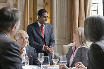 Happy businesspeople in meeting at the restaurant table