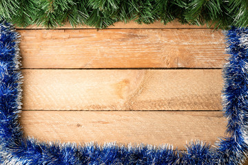 Christmas card, tree branches frame a blank space for text