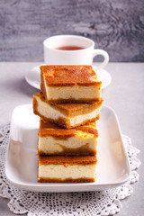 Stack of pumpkin cheesecake bars