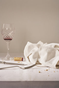 Wine Glass Cutlery Dish Cloth On Messy Table