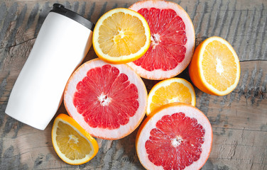 Fruits. Orange, grapefruit. White bottle