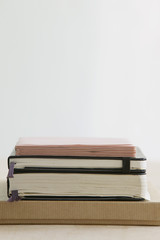 Stack of books and paper stationery studio shot