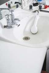 Shower head in sink at barber shop