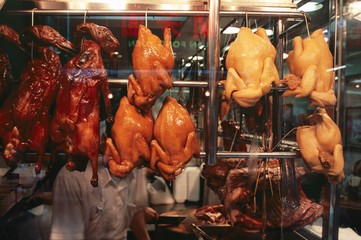 Cooked Peking duck displayed in restaurant window, Hong Kong, China