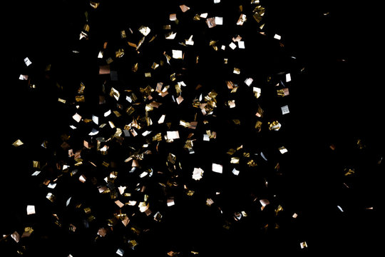 Golden Confetti On Black Background