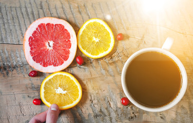 Tea on wooden table with fruits