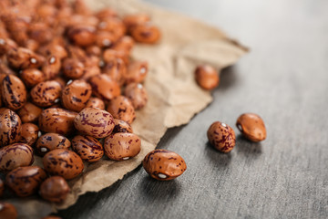 Pile of dried haricot beans on a table, closeup