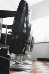 Row of barber's chairs in hair salon