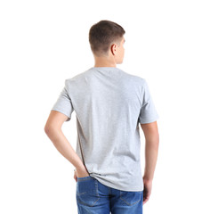 Fototapeta premium Handsome young man in blank grey t-shirt on white background