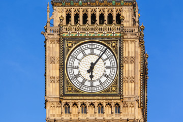 Fototapeta na wymiar Close up of Big Ben's Clock Face with a clear blue sky behind