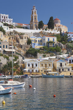 View over harbour to colourful houses and church, Gialos (Yialos), Symi (Simi), Rhodes, Dodecanese Islands, South Aegean, Greece