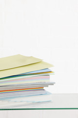 Stack of coloured stationery studio shot