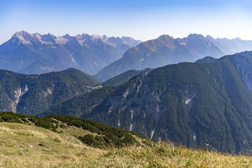 Alpine landscape from a grassy plateau