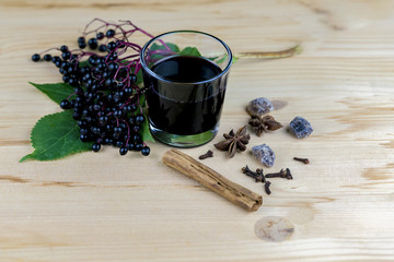 Bunch of fresh elderberries with juice and spices