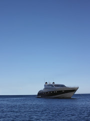 Fototapeta na wymiar Yacht moored in sea against clear blue sky