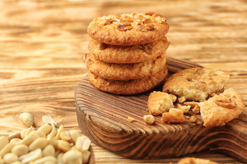Composition with delicious peanut cookies on wooden table, closeup