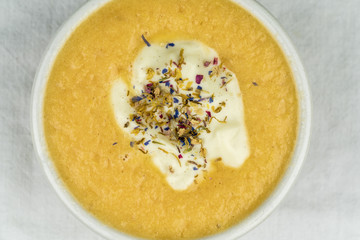 Healthy smoothie bowl garnished with herbs